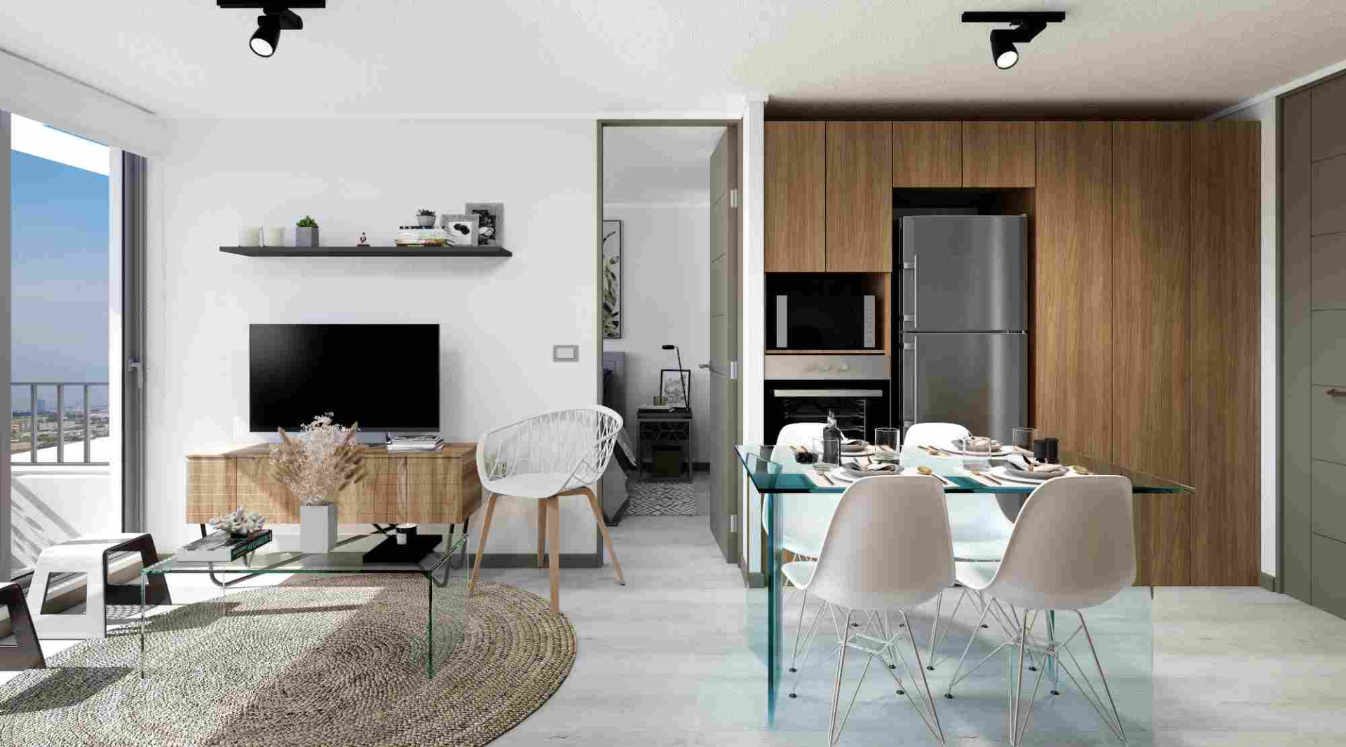 Living con televisor y cocina del departamento